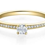 Brillant  Solitaer mit seitlichem Besatz Kanal Gelbgold